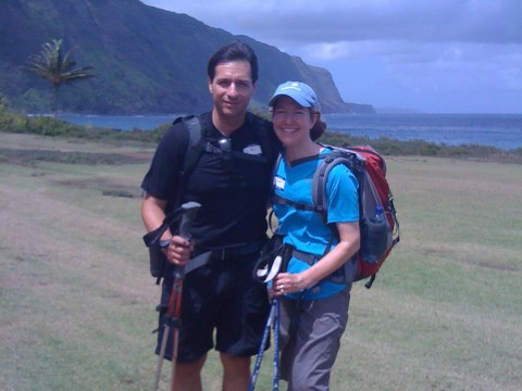 a group of people standing on top of a mountain