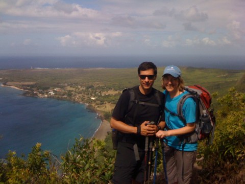 a man standing next to a body of water