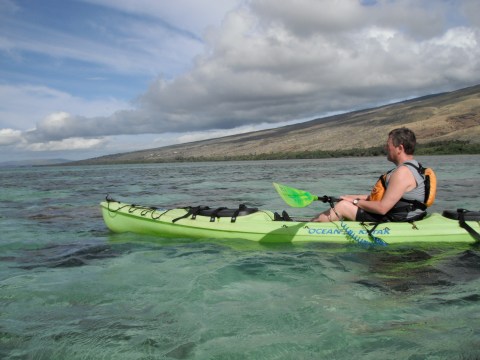 a person riding a wave on a surfboard in the water