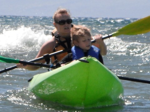 a man riding a wave on top of a body of water