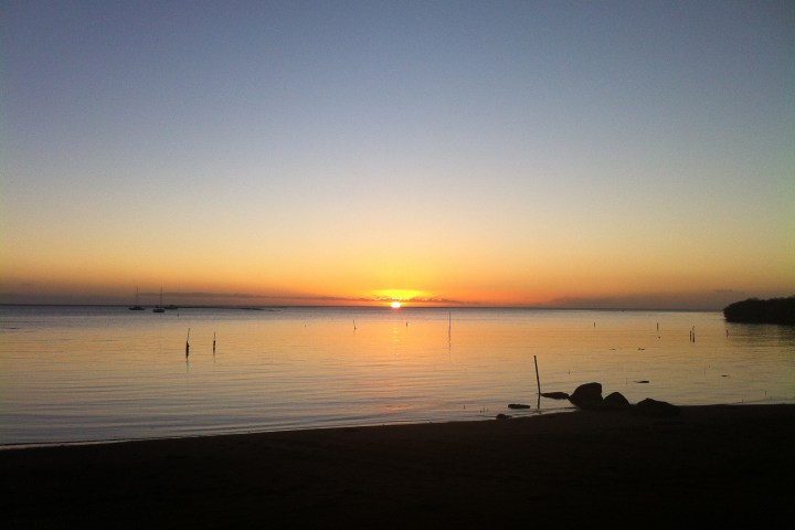 a sunset over a body of water