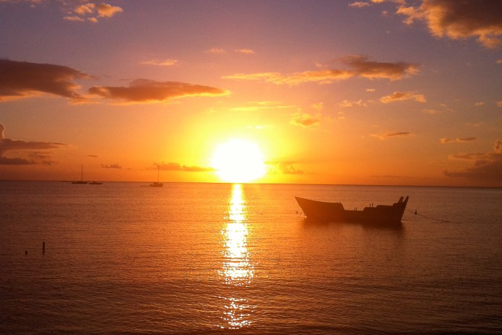a sunset over a body of water
