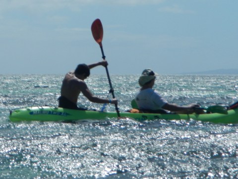 a man riding a wave on top of a body of water