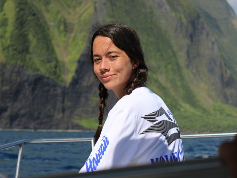 a man standing in front of a mountain
