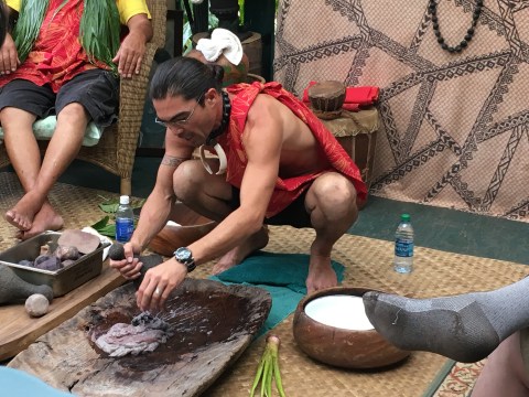 a group of people sitting at a zoo
