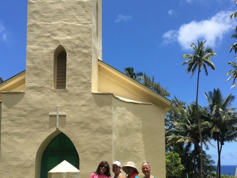 a group of people standing in front of a building