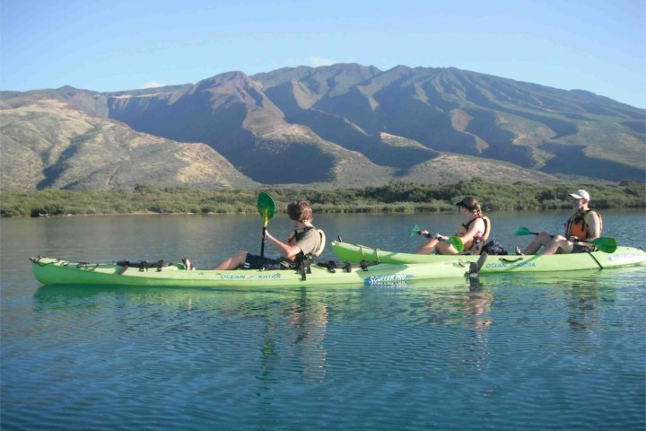 a group of people on a boat in the water