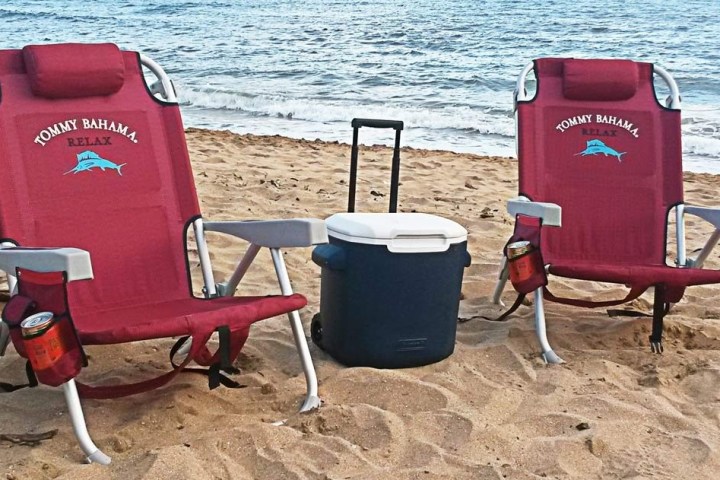 a chair sitting in front of a beach