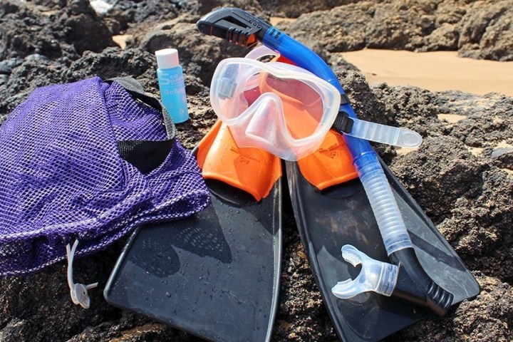 a pile of luggage sitting on top of a rock