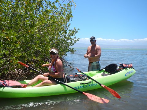 a group of people on a boat in the water