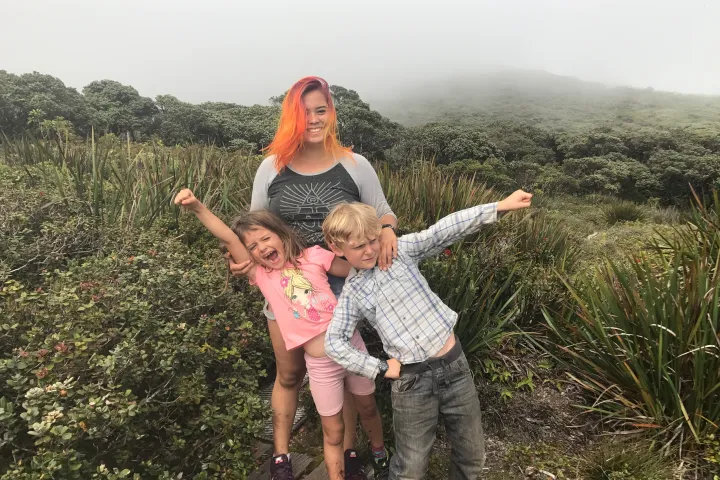 a young boy holding a kite