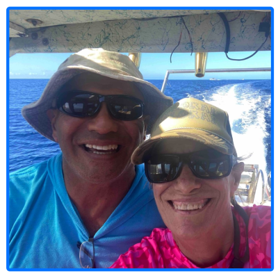 a man and a woman holding a fish