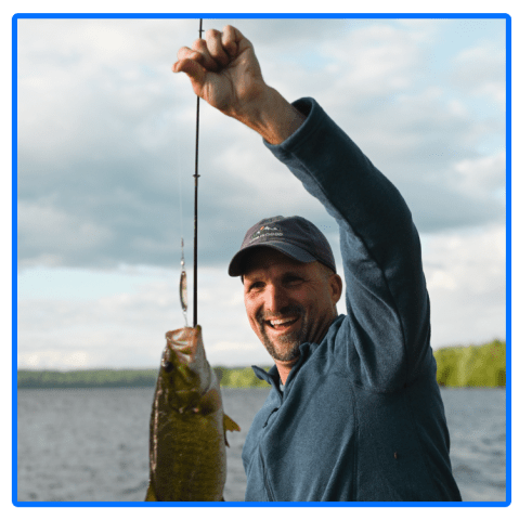 a man holding a fish